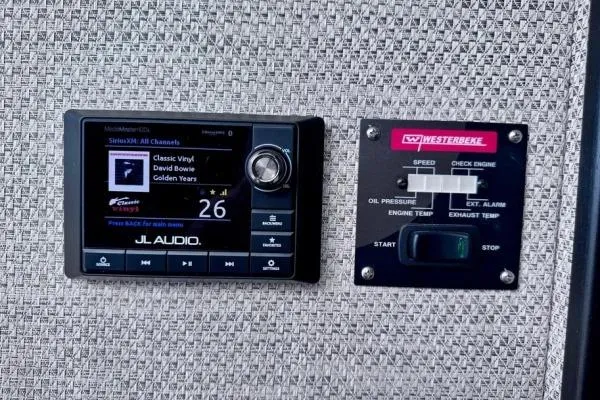 Slide: The Image of JL Audio system and Westerbeke control panel on a 2022 Stamas 370 Aegean boat. - 25