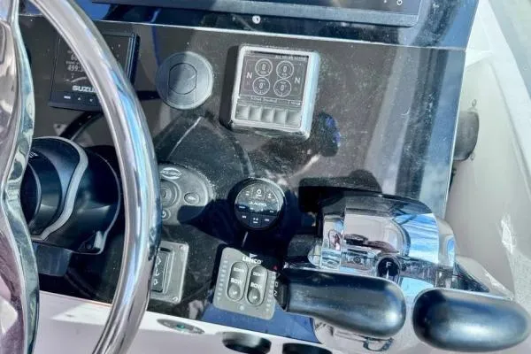 Slide: The Image of Control panel of 2022 Stamas 370 Aegean boat with steering wheel and throttle. - 31
