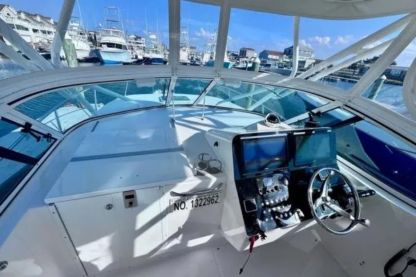 Slide: The Image of 2022 Stamas 370 Aegean boat cockpit with modern navigation equipment, docked at a marina. - 34