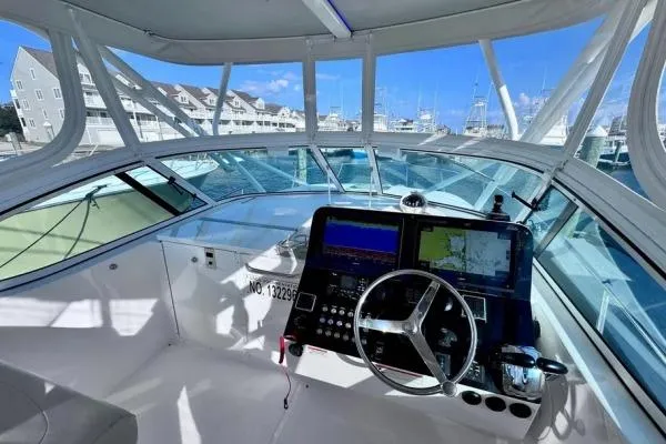 Slide: The Image of 2022 Stamas 370 Aegean boat cockpit with navigation equipment and marina view. - 36