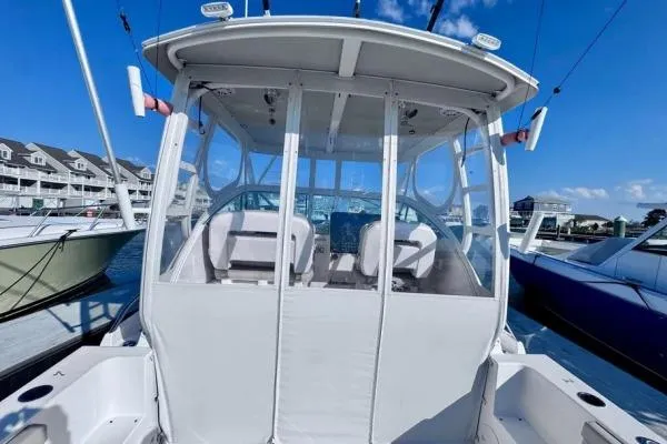 Slide: The Image of 2022 Stamas 370 Aegean boat docked, featuring enclosed cockpit and clear skies. - 39
