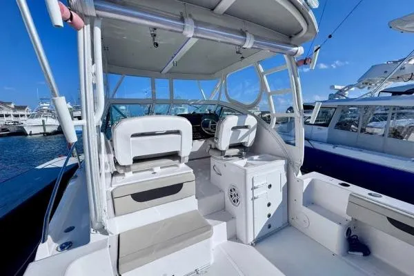 Slide: The Image of 2022 Stamas 370 Aegean boat interior with helm, seating, and clear blue sky. - 40