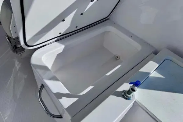 Slide: The Image of 2022 Stamas 370 Aegean boat storage compartment with open lid and faucet. - 46