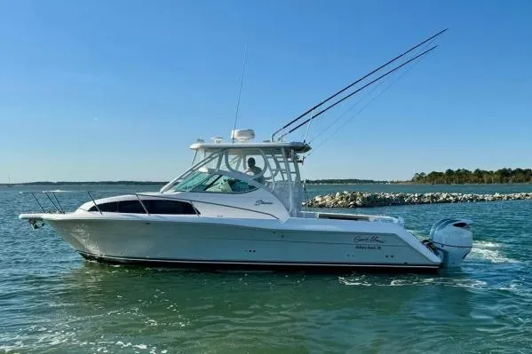 Slide: The Image of 2022 Stamas 370 Aegean boat cruising on a sunny day near rocky shoreline. - 55