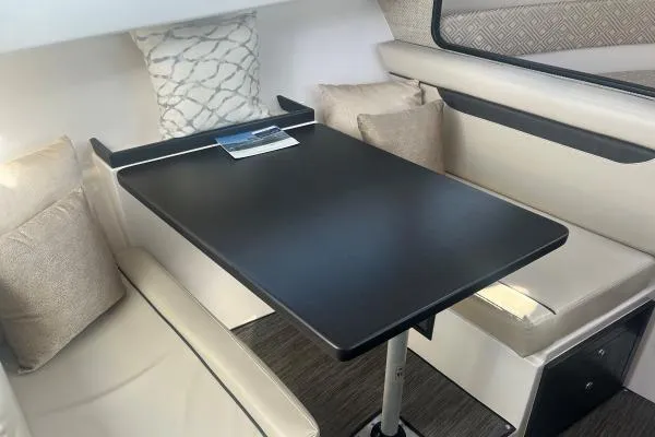 Slide: The Image of 2022 Stamas 370 Aegean interior with sleek dining area and comfortable seating. - 6