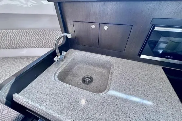 Slide: The Image of Modern kitchen sink area in 2022 Stamas 370 Aegean boat, featuring sleek countertop design. - 8