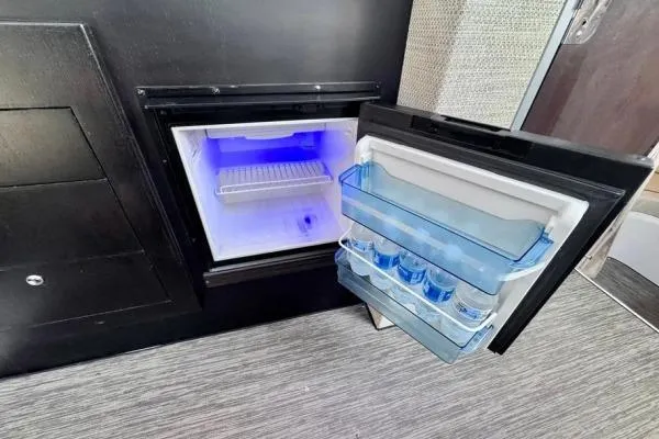 Slide: The Image of Compact refrigerator in 2022 Stamas 370 Aegean yacht, open with water bottles inside. - 9