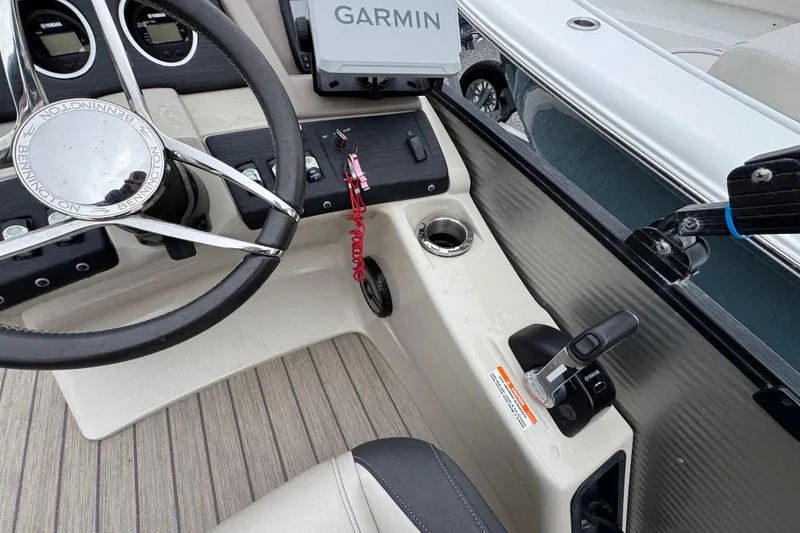 Slide: The Image of 2019 Bennington 25 RSBDN boat dashboard with Garmin GPS and steering wheel. - 22