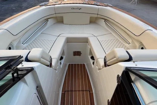 Slide: The Image of 2022 Chris-Craft Launch 25 GT boat interior with luxurious seating and wood accents. - 10