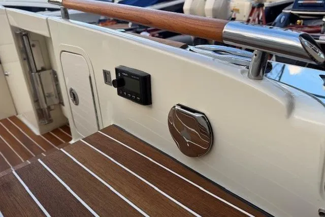 Slide: The Image of 2022 Chris-Craft Launch 25 GT boat interior with wood accents and control panel. - 17