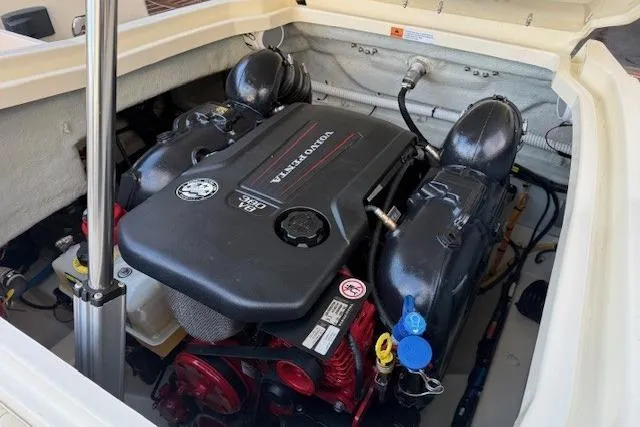 Slide: The Image of Engine compartment of a 2022 Chris-Craft Launch 25 GT boat, featuring a Volvo Penta engine. - 18