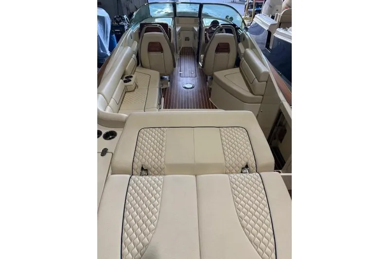 Slide: The Image of Luxurious interior of 2022 Chris-Craft Launch 25 GT boat with elegant seating and wood flooring. - 22