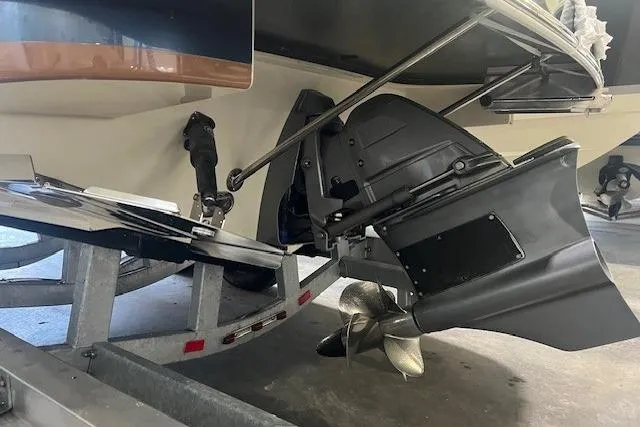 Slide: The Image of 2022 Chris-Craft Launch 25 GT boat on trailer, showing propeller and stern details. - 24