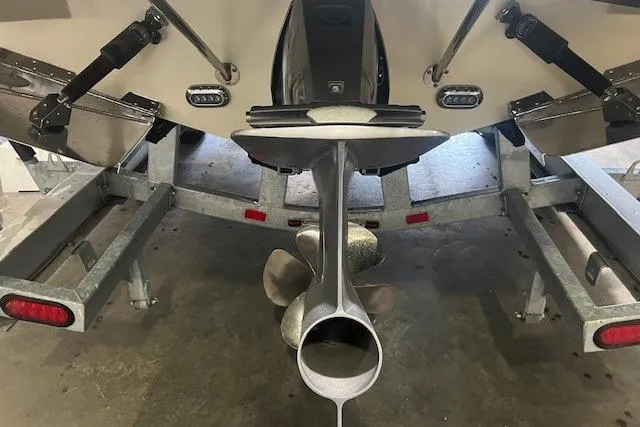 Slide: The Image of 2022 Chris-Craft Launch 25 GT boat on trailer, showcasing propeller and rear details. - 26
