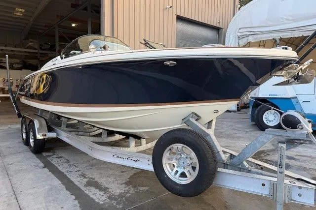 Slide: The Image of 2022 Chris-Craft Launch 25 GT boat on trailer in a storage facility. - 4