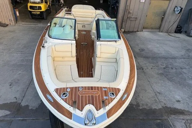 Slide: The Image of 2022 Chris-Craft Launch 25 GT boat with elegant wood detailing and spacious seating. - 6
