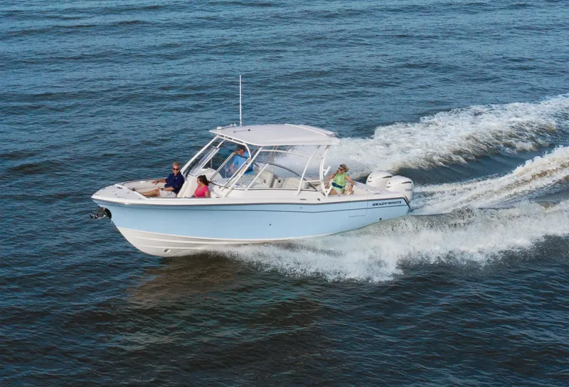 The Image of 2026 Grady-White Freedom 285 boat cruising on open water with passengers. - 0