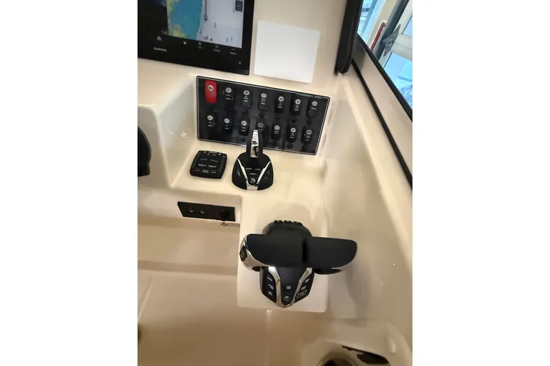 Slide: The Image of Control console of Grady-White Freedom 285 boat, year 2026. - 22