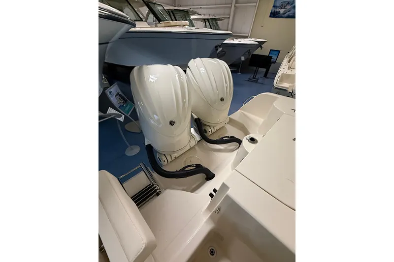Slide: The Image of Grady-White Freedom 285 boat with dual outboard engines, year 2026. - 23