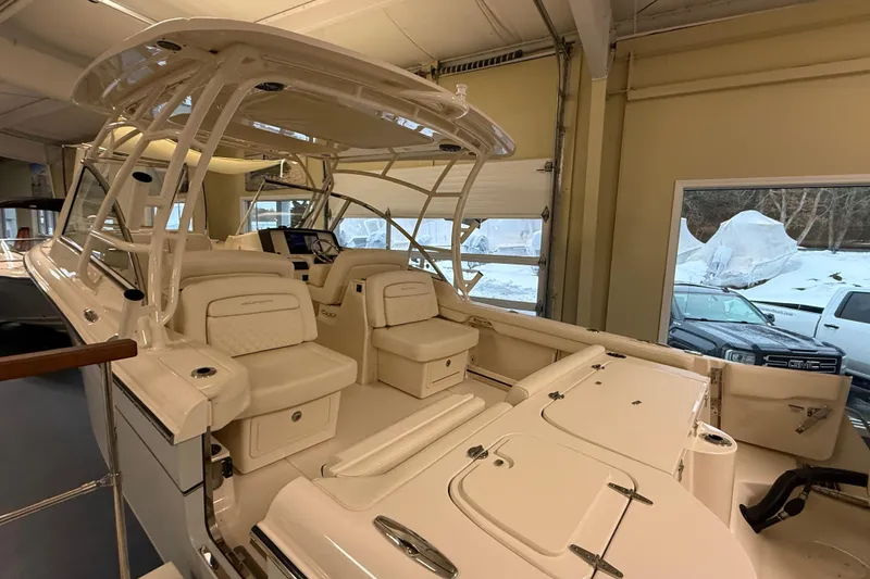 Slide: The Image of Interior view of a 2026 Grady-White Freedom 285 boat in showroom. - 9