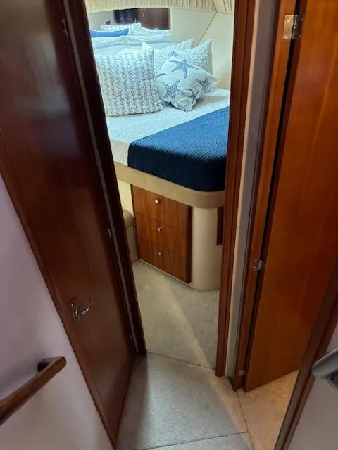 Slide: The Image of Cozy bedroom in 2004 Meridian Sedan Bridge 341 yacht with nautical-themed decor. - 18