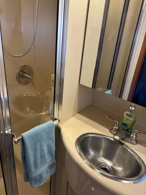 Slide: The Image of 2004 Meridian Sedan Bridge 341 bathroom with shower, sink, and towel. - 23
