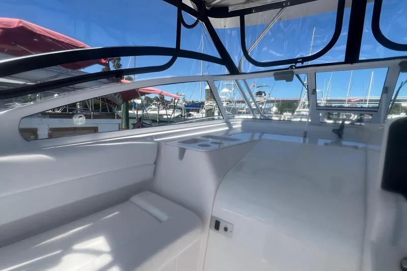 Slide: The Image of 2008 Pro-Line 32 Express boat interior with clear windows and marina view. - 11