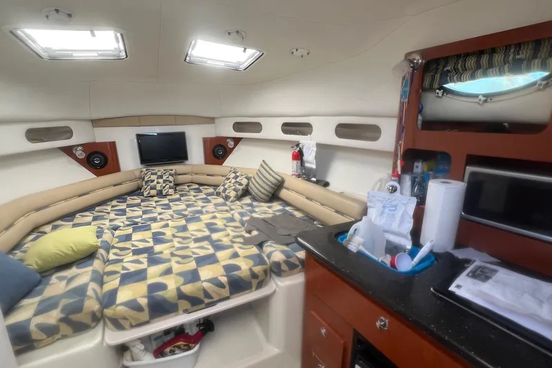 Slide: The Image of Interior of 2008 Pro-Line 32 Express boat with cozy seating and modern amenities. - 13