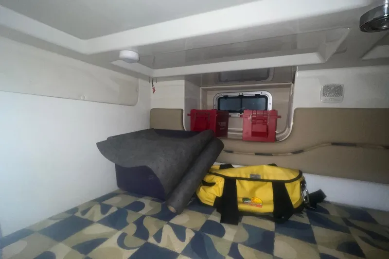 Slide: The Image of 2008 Pro-Line 32 Express cabin interior with storage, window, and gear bags. - 21