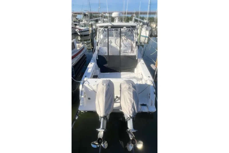 Slide: The Image of 2008 Pro-Line 32 Express boat docked with twin outboard motors. - 3