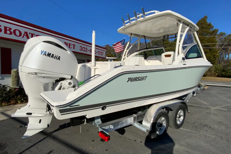 Slide: The Image of 2026 Pursuit DC 246 Dual Console boat with Yamaha engine on trailer. - 10