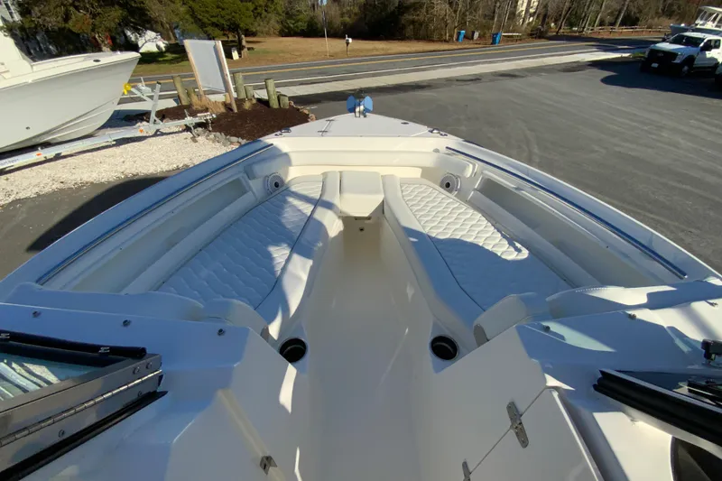 Slide: The Image of 2026 Pursuit DC 246 Dual Console boat with spacious seating and sleek design. - 25