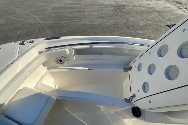 Slide: The Image of 2026 Pursuit DC 246 Dual Console boat interior with seating and storage compartments. - 26