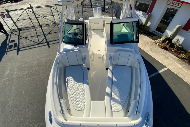 Slide: The Image of 2026 Pursuit DC 246 Dual Console boat with spacious seating and modern design. - 30