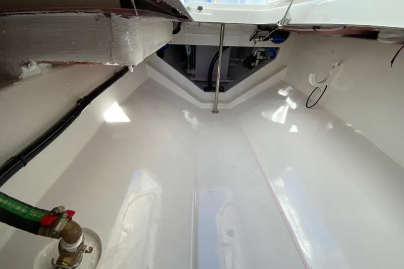 Slide: The Image of Interior view of 2026 Pursuit DC 246 Dual Console boat, showcasing clean, spacious design. - 32