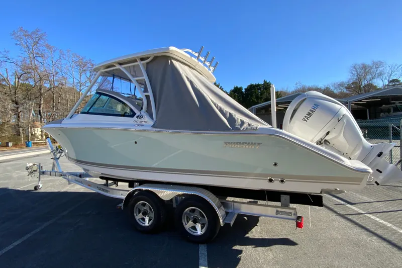 Slide: The Image of 2026 Pursuit DC 246 Dual Console boat on trailer with Yamaha engine. - 45