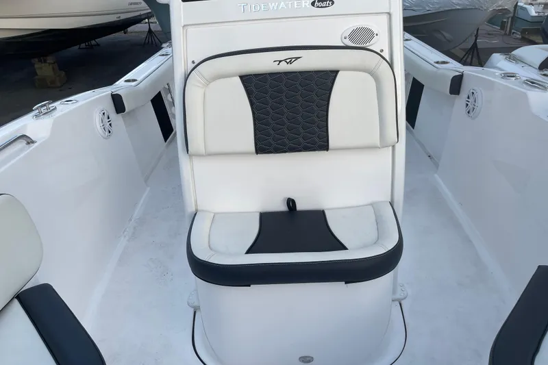 Slide: The Image of 2024 Tidewater 232 CC Adventure boat seat with black and white upholstery. - 7