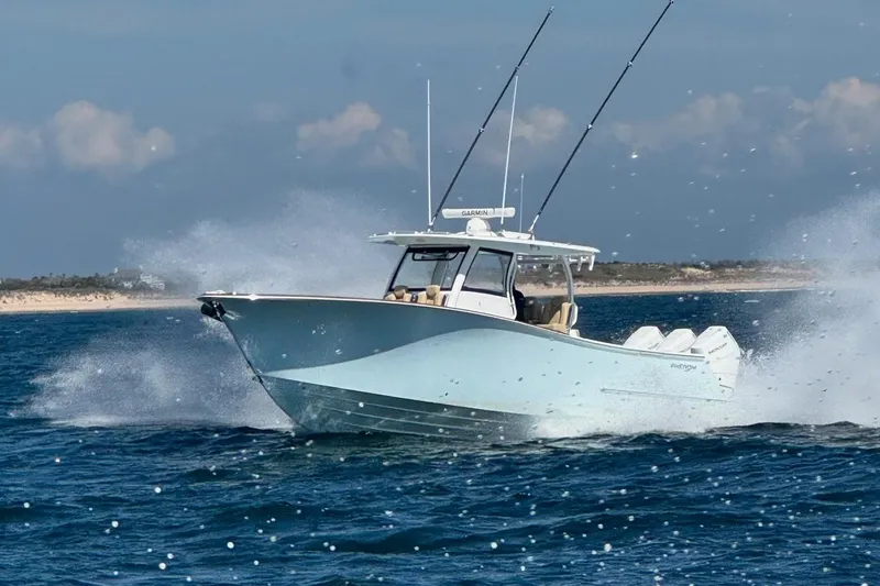 Slide: The Image of Phenom 37 boat 2026 on open sea, splashing water. - 0