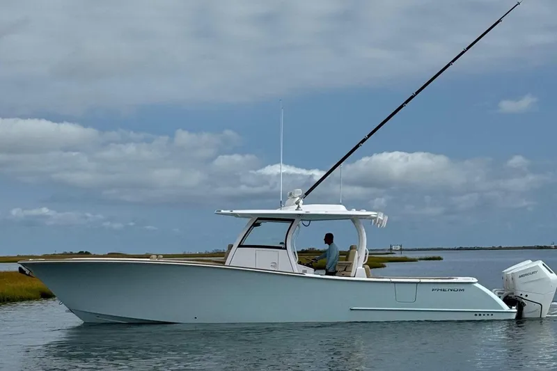 Slide: The Image of Phenom 37 boat 2026 on calm water with angler. - 1