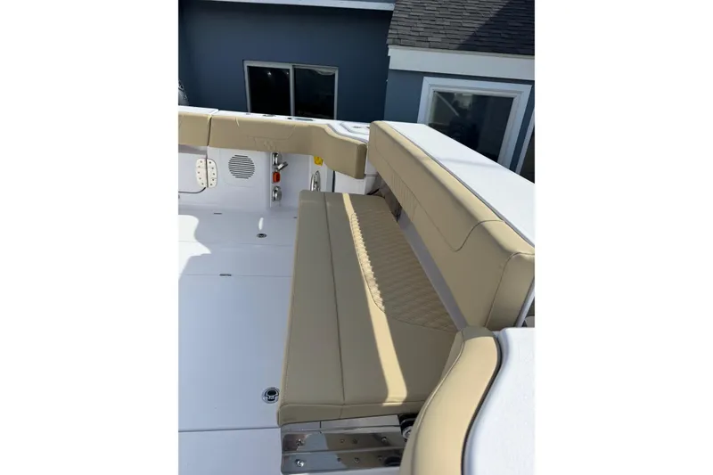 Slide: The Image of 2026 Phenom 37 Center Console boat with beige seating and modern design. - 16