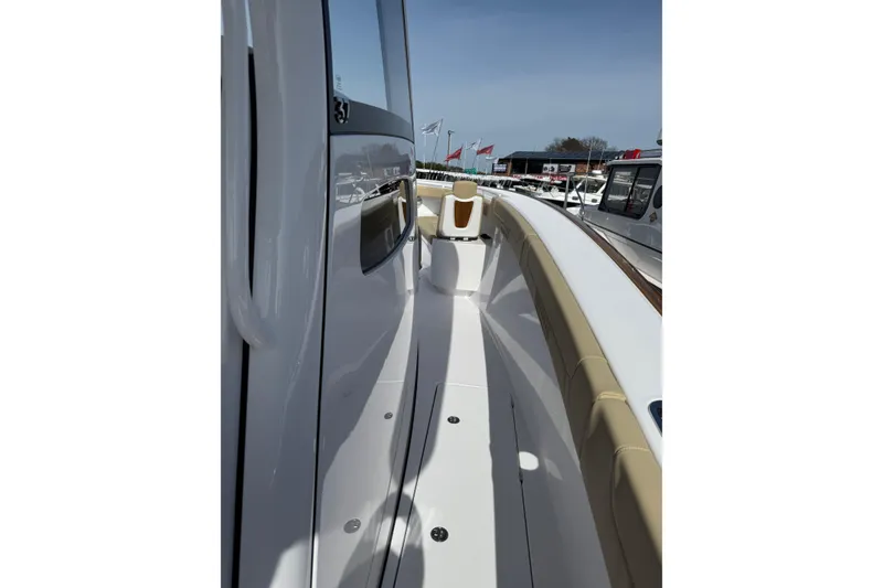 Slide: The Image of 2026 Phenom 37 Center Console boat deck with sleek design and beige seating. - 20