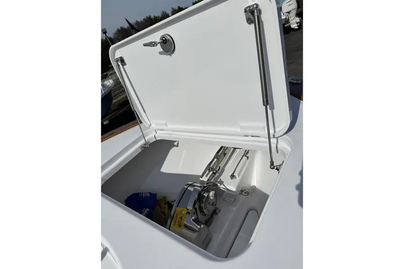 Slide: The Image of Open hatch of 2026 Phenom 37 Center Console boat, showcasing interior storage. - 25