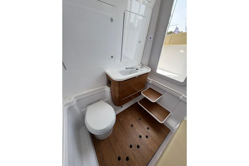 Slide: The Image of 2026 Phenom 37 Center Console boat interior with modern bathroom design. - 28