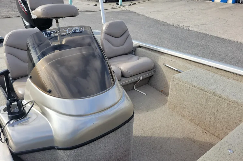 Slide: The Image of 2002 Tracker Pro Team 175 boat interior with seating and console. - 12