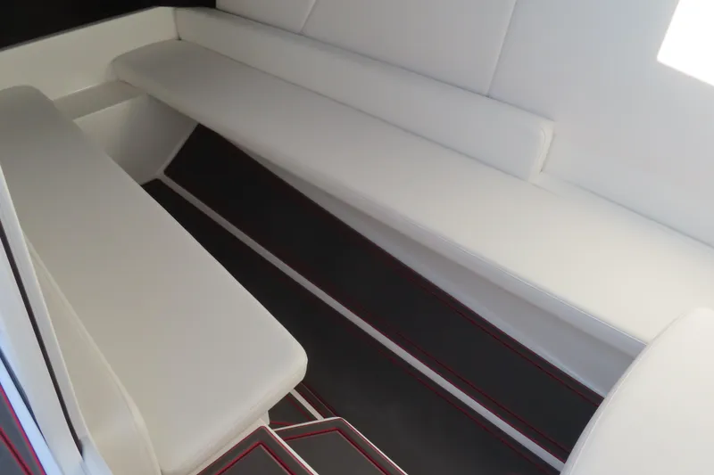 Slide: The Image of 2026 Sunsation 32 CCX interior with sleek white seating and modern design. - 10