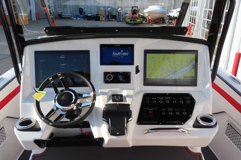 Slide: The Image of 2026 Sunsation 32 CCX boat dashboard with advanced navigation and control systems. - 13