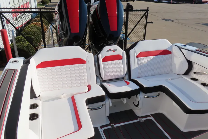 Slide: The Image of 2026 Sunsation 32 CCX boat interior with white and red seating, dual engines visible. - 5