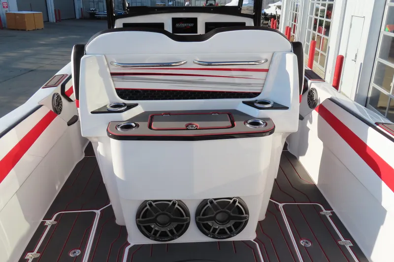 Slide: The Image of 2026 Sunsation 32 CCX boat interior with red accents and modern design features. - 6