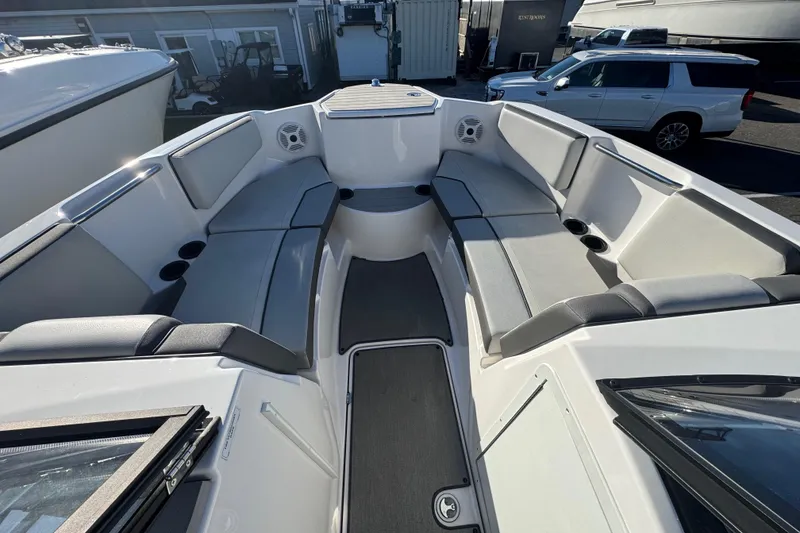 Slide: The Image of 2023 Yamaha Boats AR220 interior with spacious seating and modern design. - 11