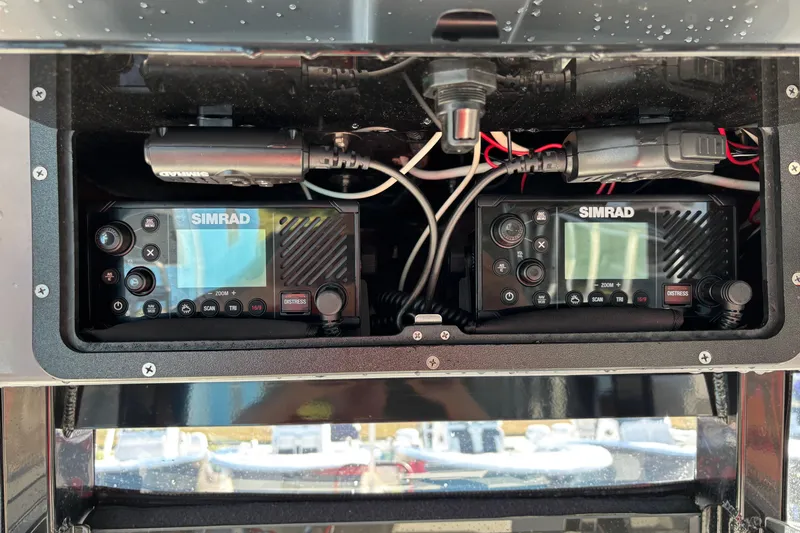 Slide: The Image of Simrad marine electronics on 2023 NauticStar 28 XS boat dashboard. - 11